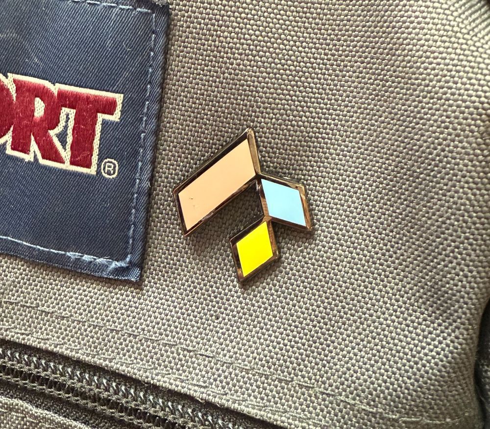 FileScience branded pin showing company culture and team identity